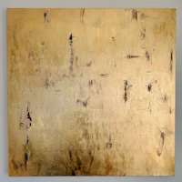 a painting with gold and black paint on it